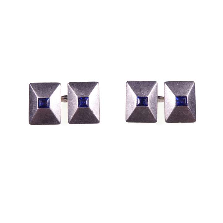 Pair of Art Deco platinum and sapphire rectangular panel cufflinks of low pyramid form